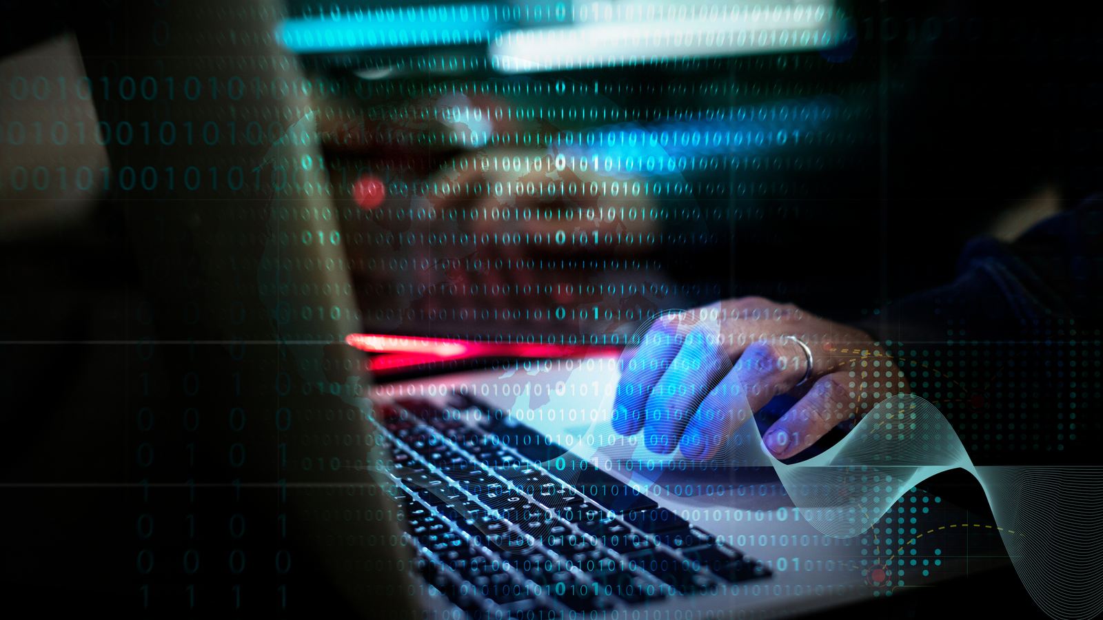 Mains sur un clavier d'ordinateur dans une lumière bleutée, données en surimpression